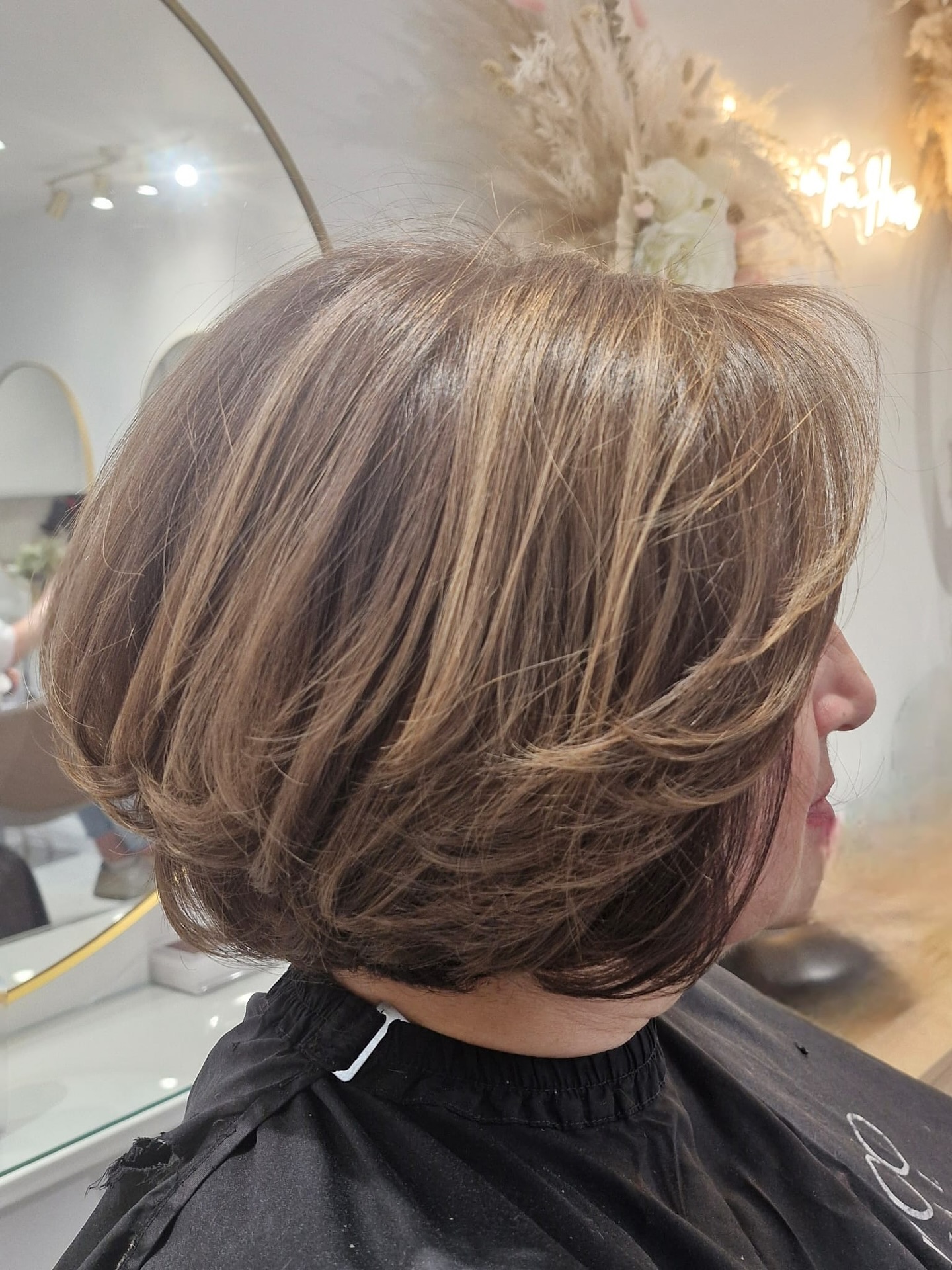 Softly Textured Neck-Length Bob with Subtle Highlights
