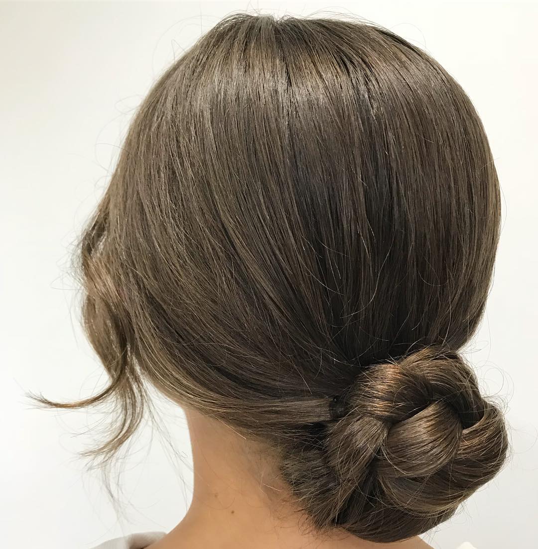 Elegant Twisted Low Bun with Soft Face-Framing Strands