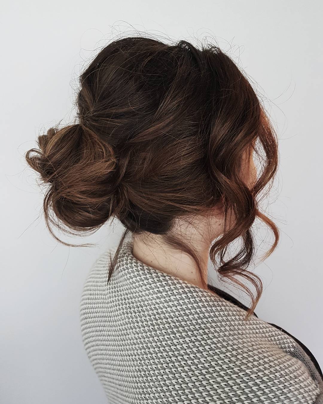 Romantic Messy Bun with Soft Face-Framing Curls