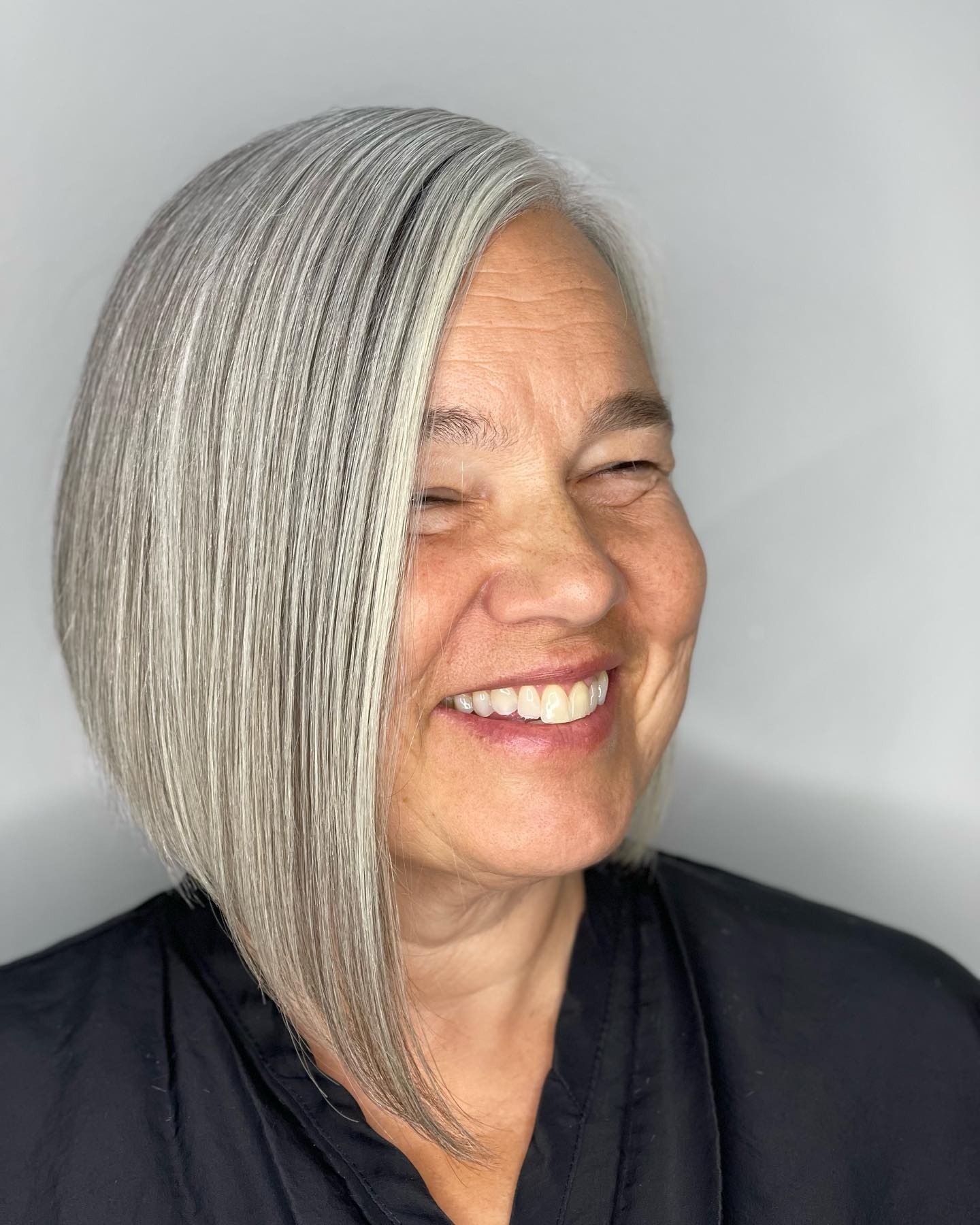 Sleek Asymmetrical Silver Bob with Textured Ends
