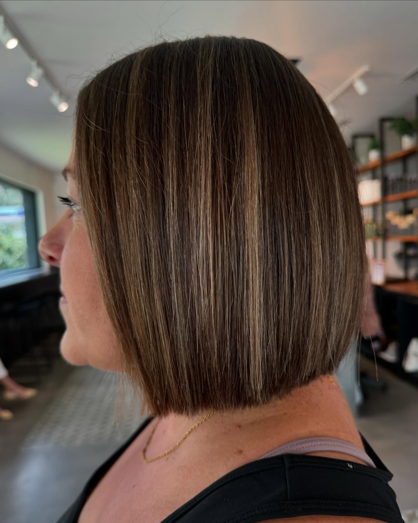 Sleek Brown Blunt Bob with Subtle Caramel Highlights