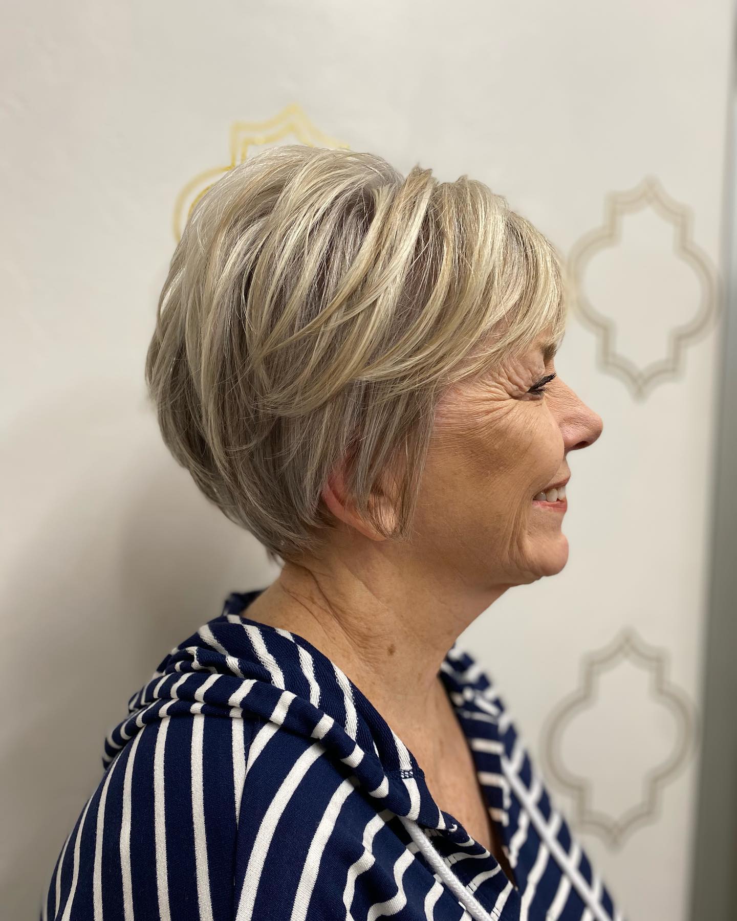 Dynamic Short Layered Pixie with Soft Highlights