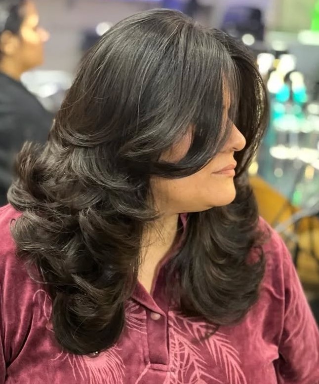 Elegant Voluminous Layered Cut with Side Swept Bangs