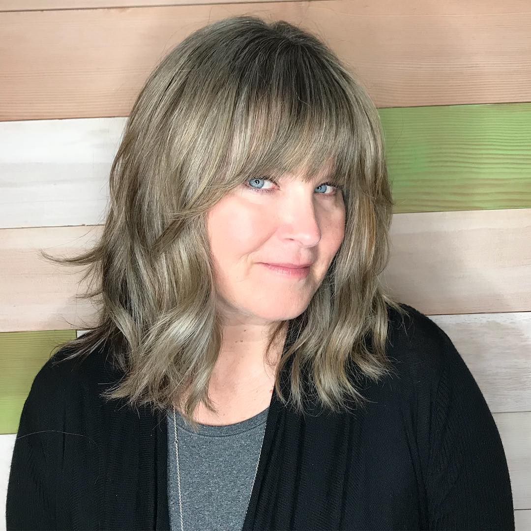 Textured Mid-Length Cut with Soft Bangs and Subtle Highlights