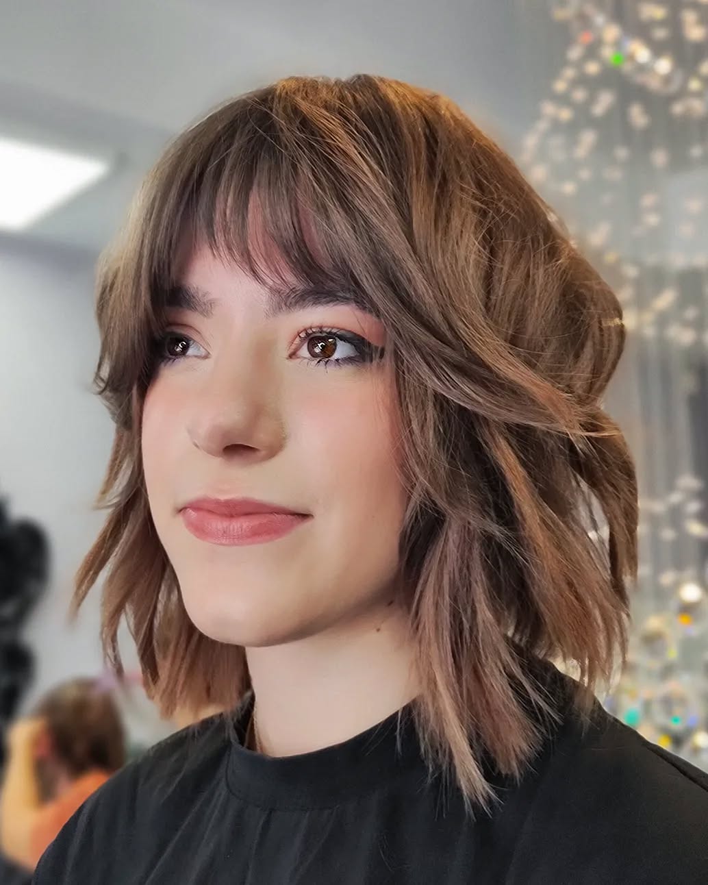 Effortlessly Layered Wavy Bob with Soft Bangs