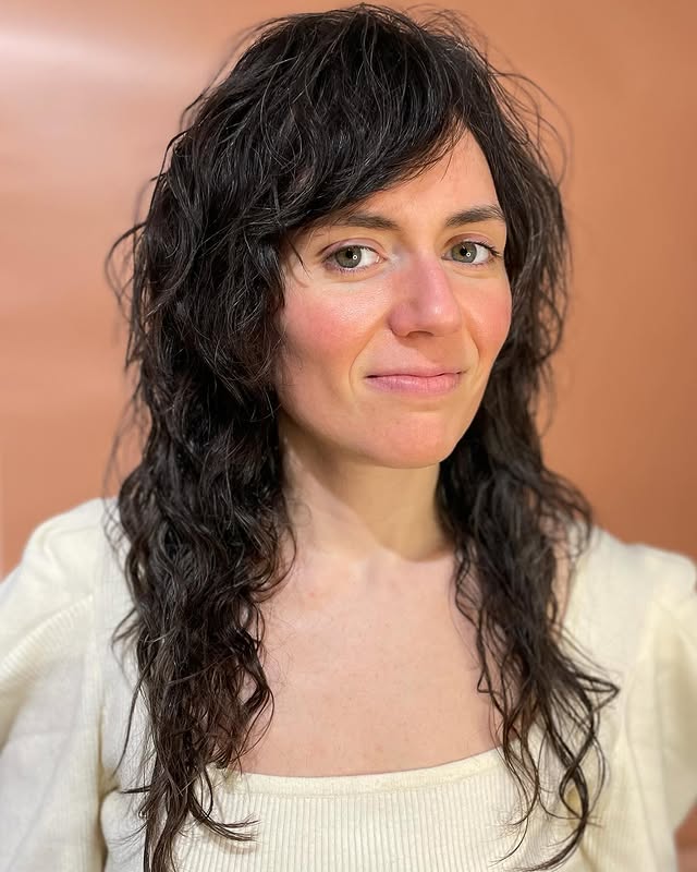 Textured Curly Cut with Playful Side Bangs