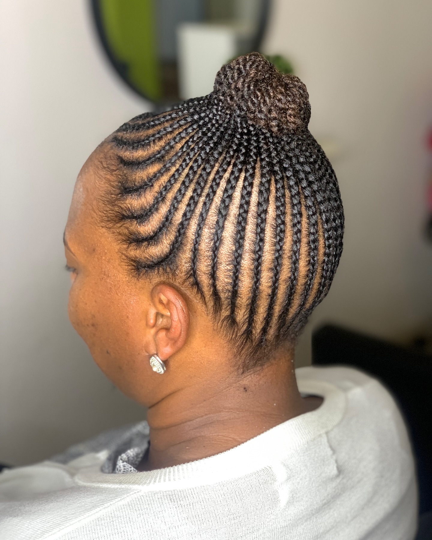 Elegant Twisted Bun with Defined Cornrows