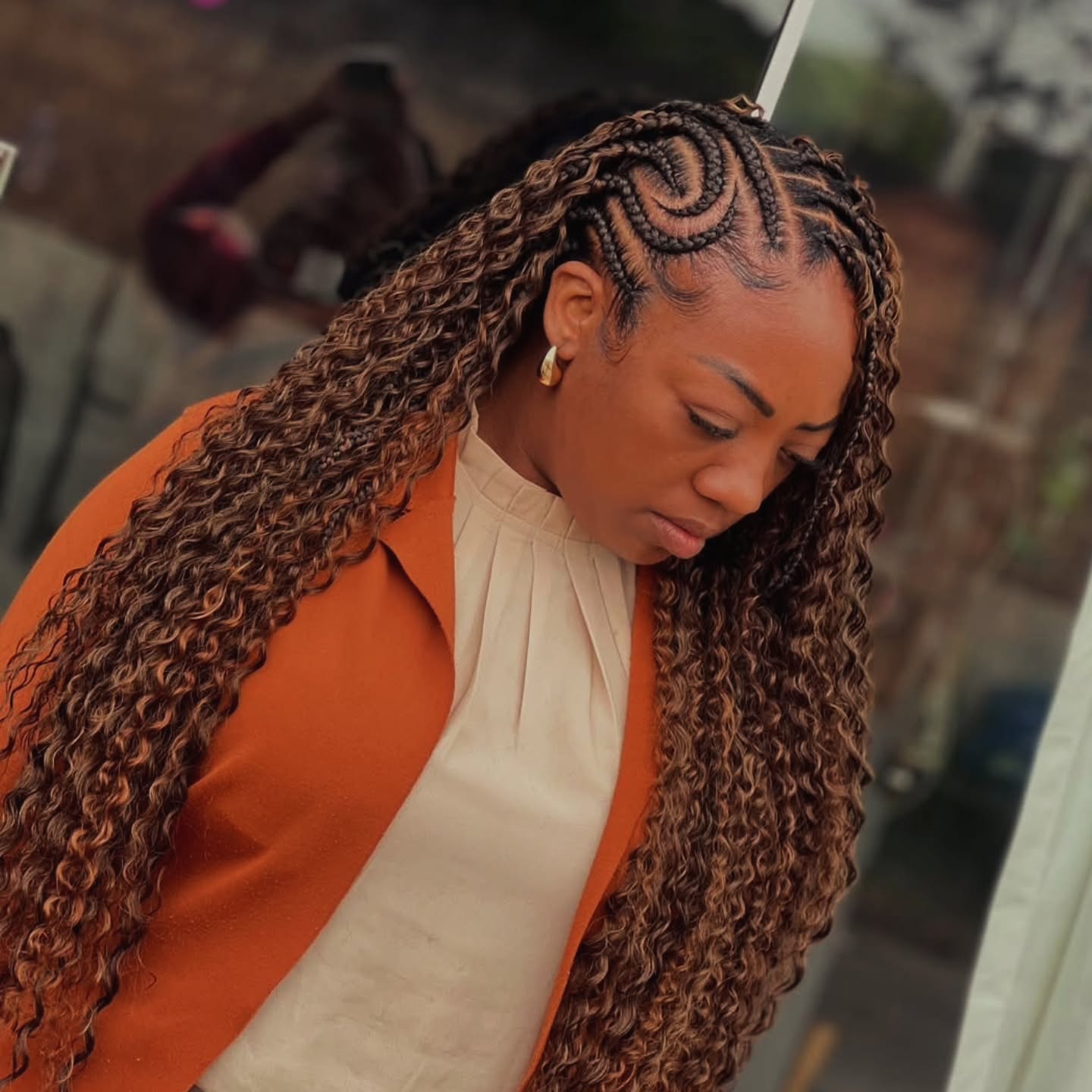 Intricate Braided Cornrows with Long Curly Extensions