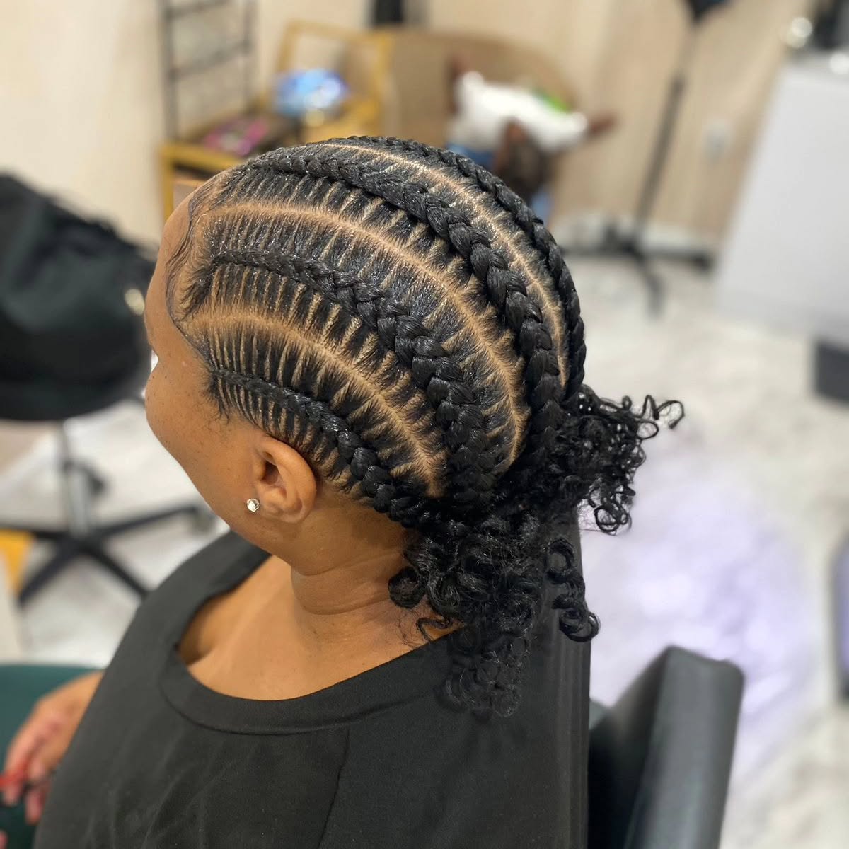 Intricate Curly Updo with Defined Braids