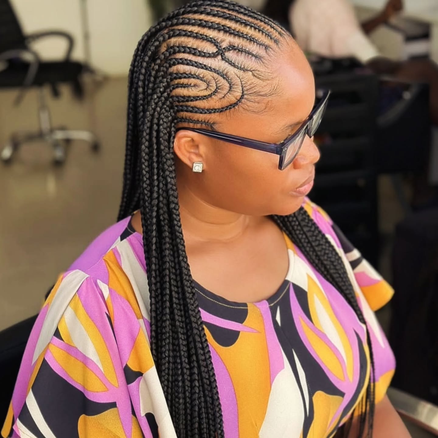 Intricate Side-Swept Box Braids with Defined Patterns