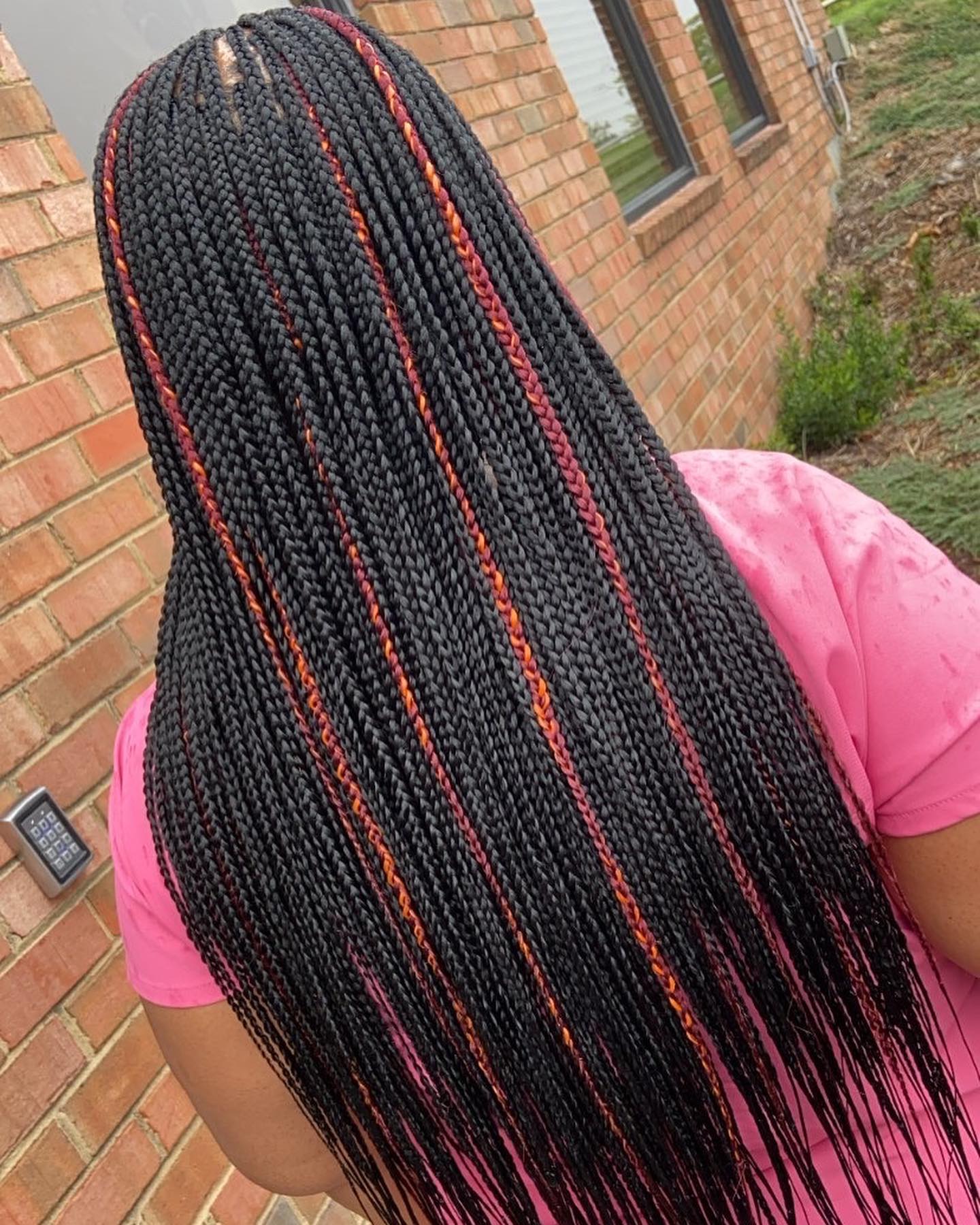 bold black box braids with fiery highlights
