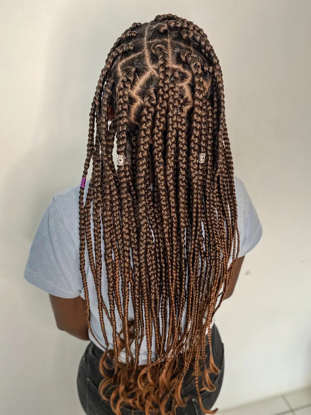 Playful Waist-Length Box Braids with Spiraled Tips