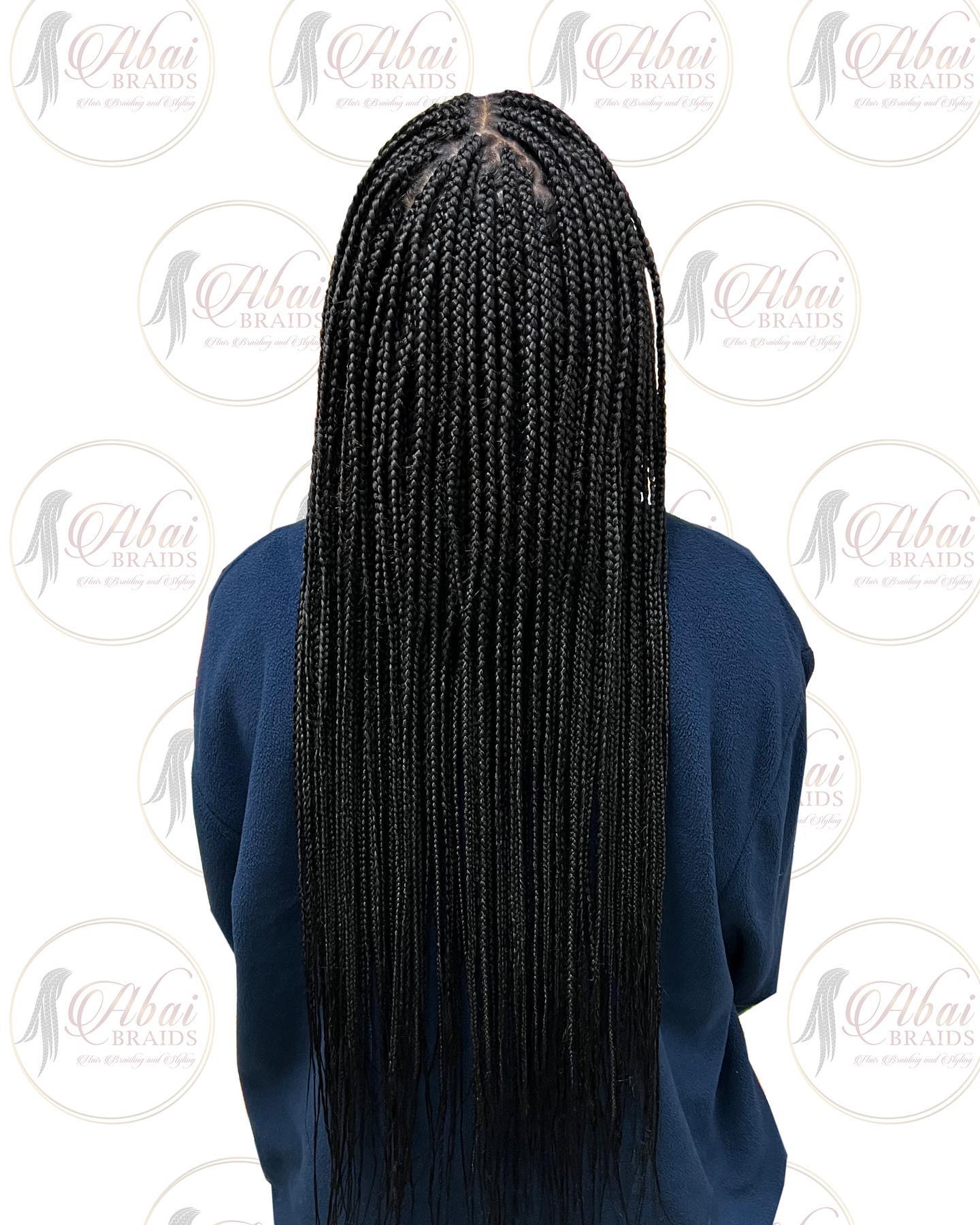 Sleek Waist-Length Box Braids with Defined Parting