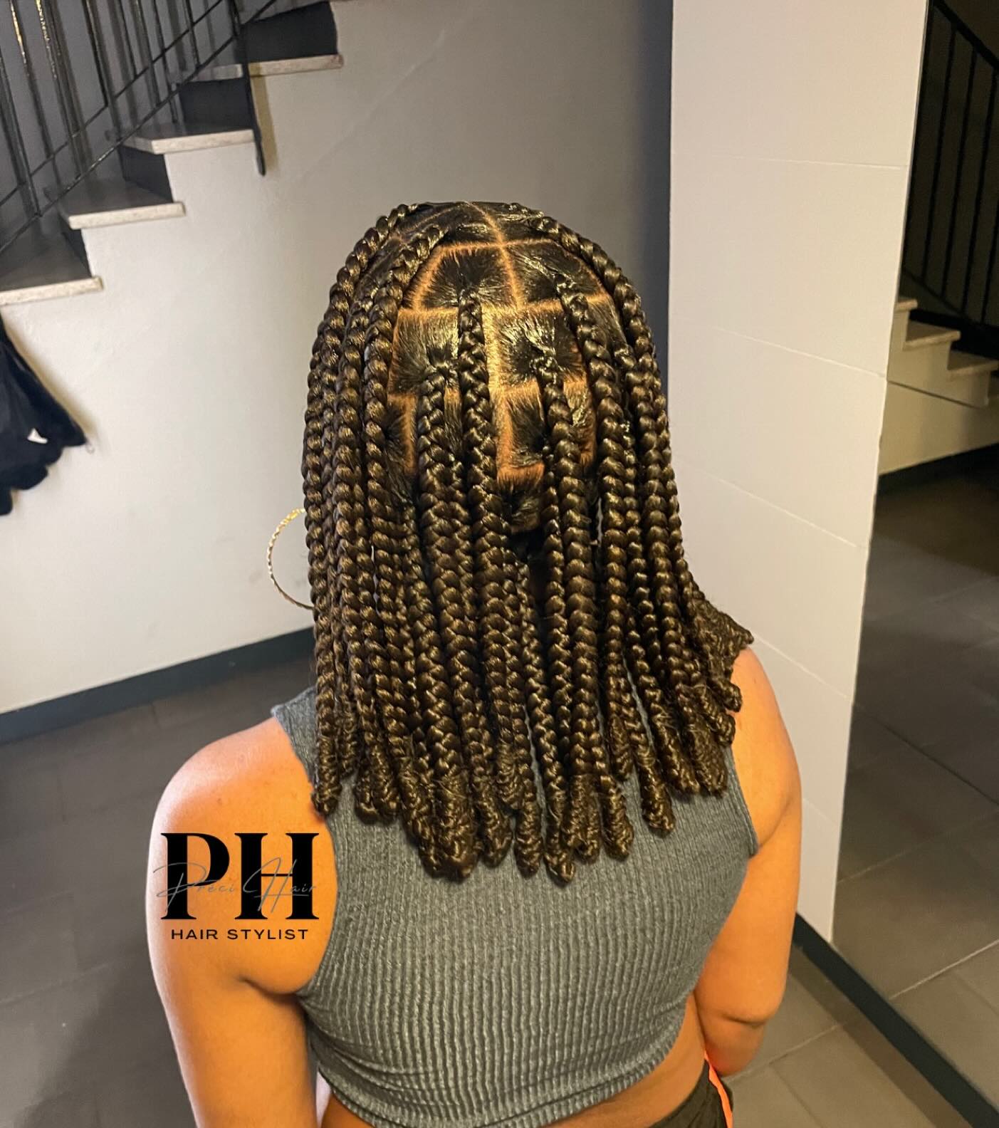 Textured Mid-Length Box Braids with Defined Parting