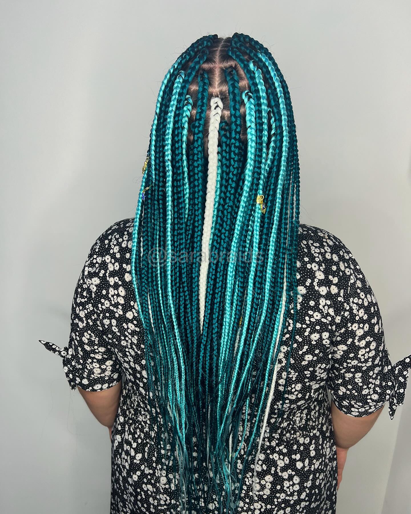 Trendy Waist-Length Box Braids with Teal Ombre Highlights