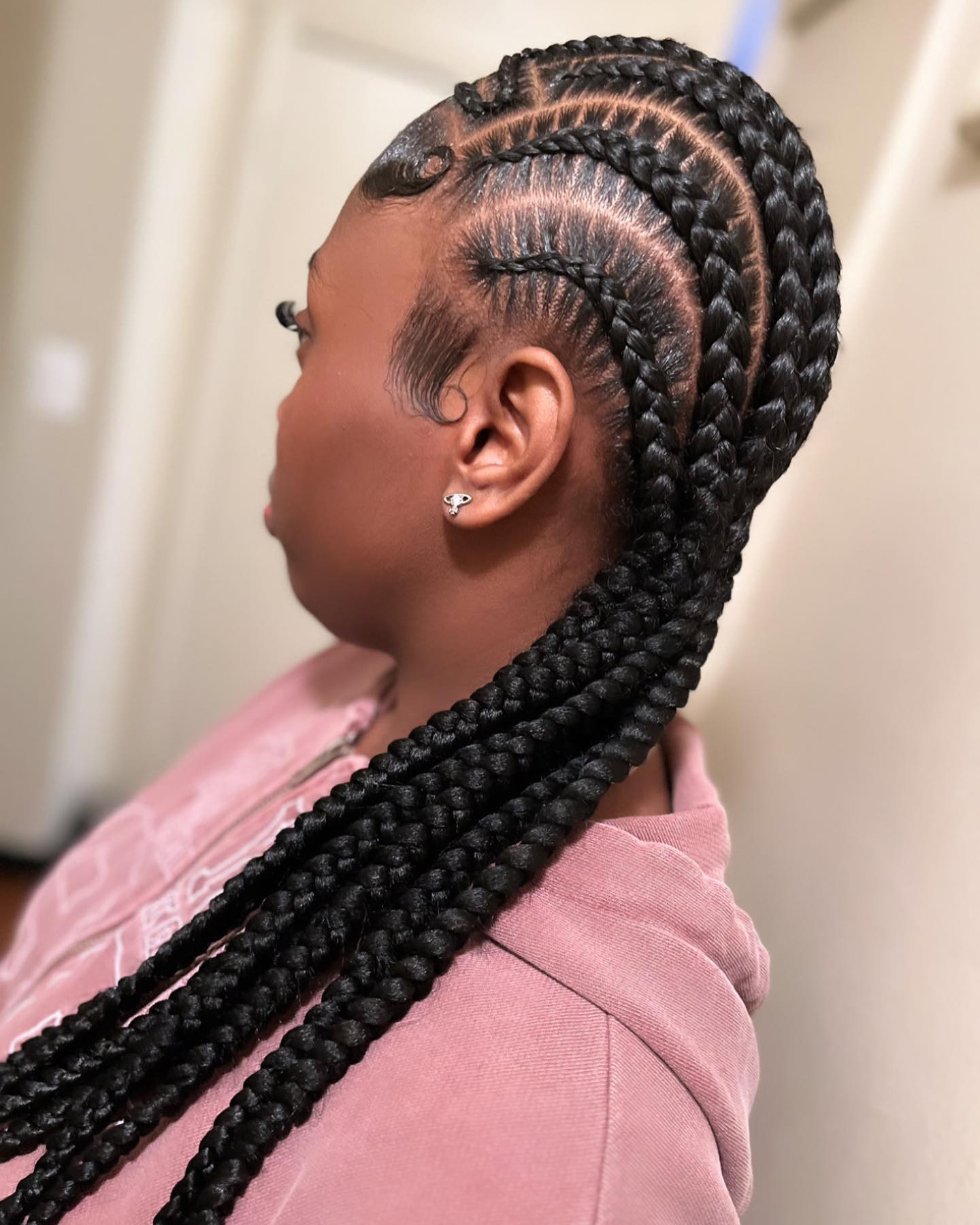 Chic Intricate Stitch Braids with Defined Parting