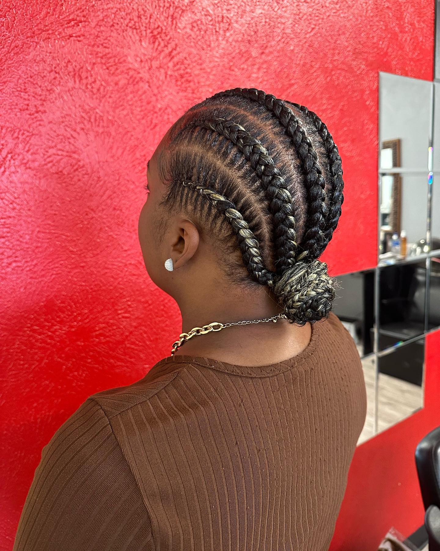 Chic Twisted Stitch Braids with Elegant Low Bun