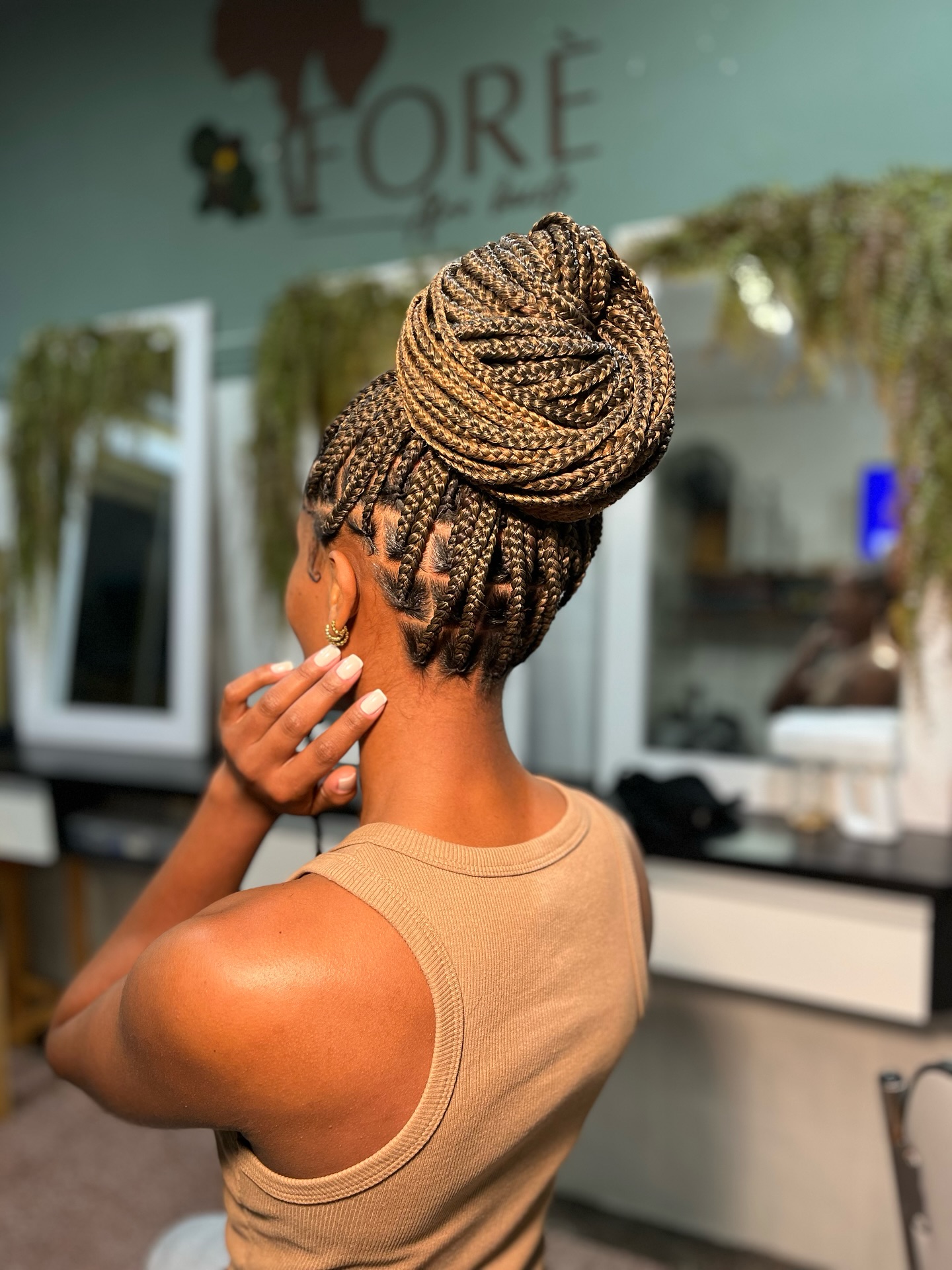Elegant High Knotless Braids with Intricate Bun