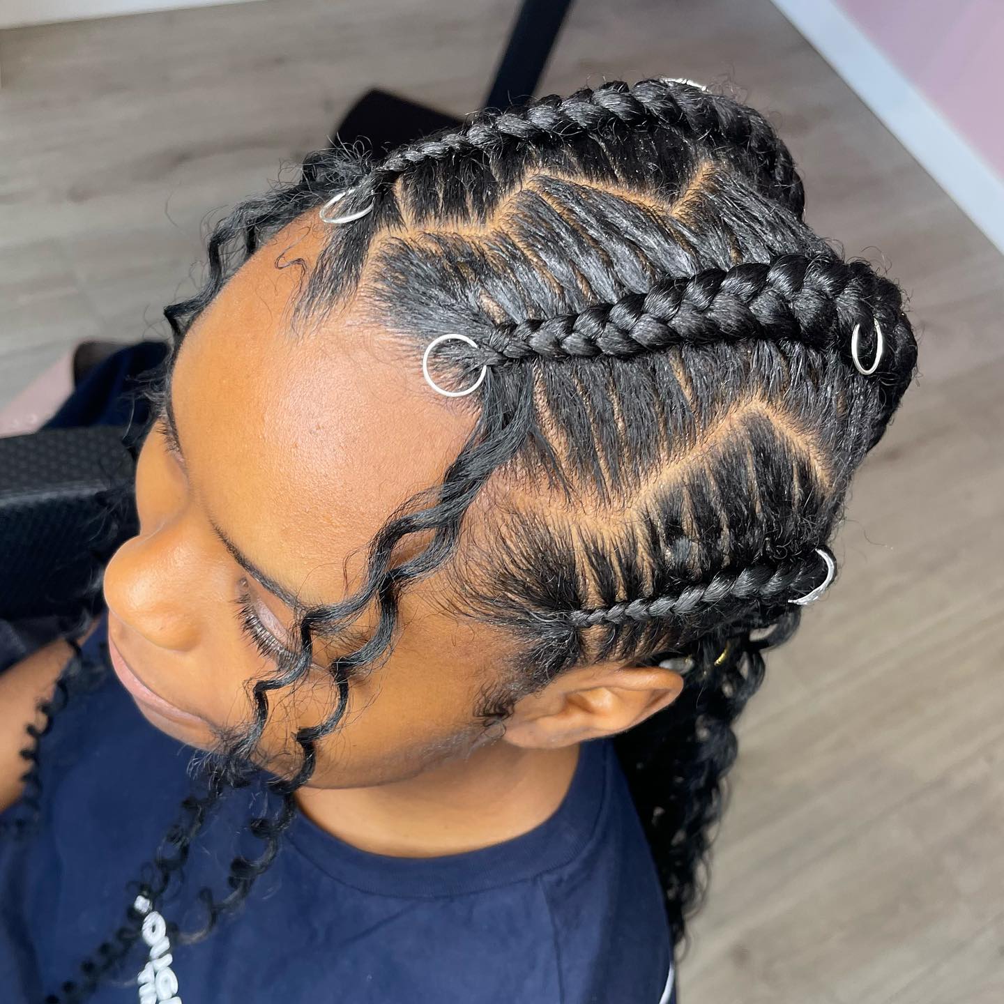Intricate Stitch Braids with Defined Curls