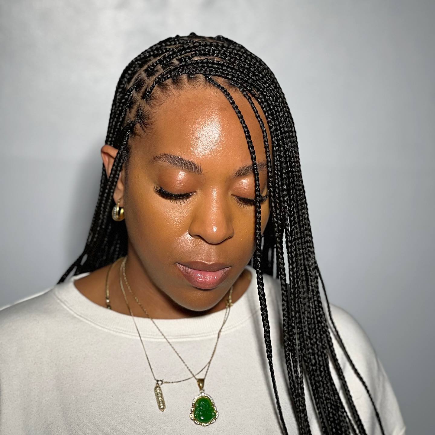 Sleek Long Knotless Braids with Intricate Side Parting