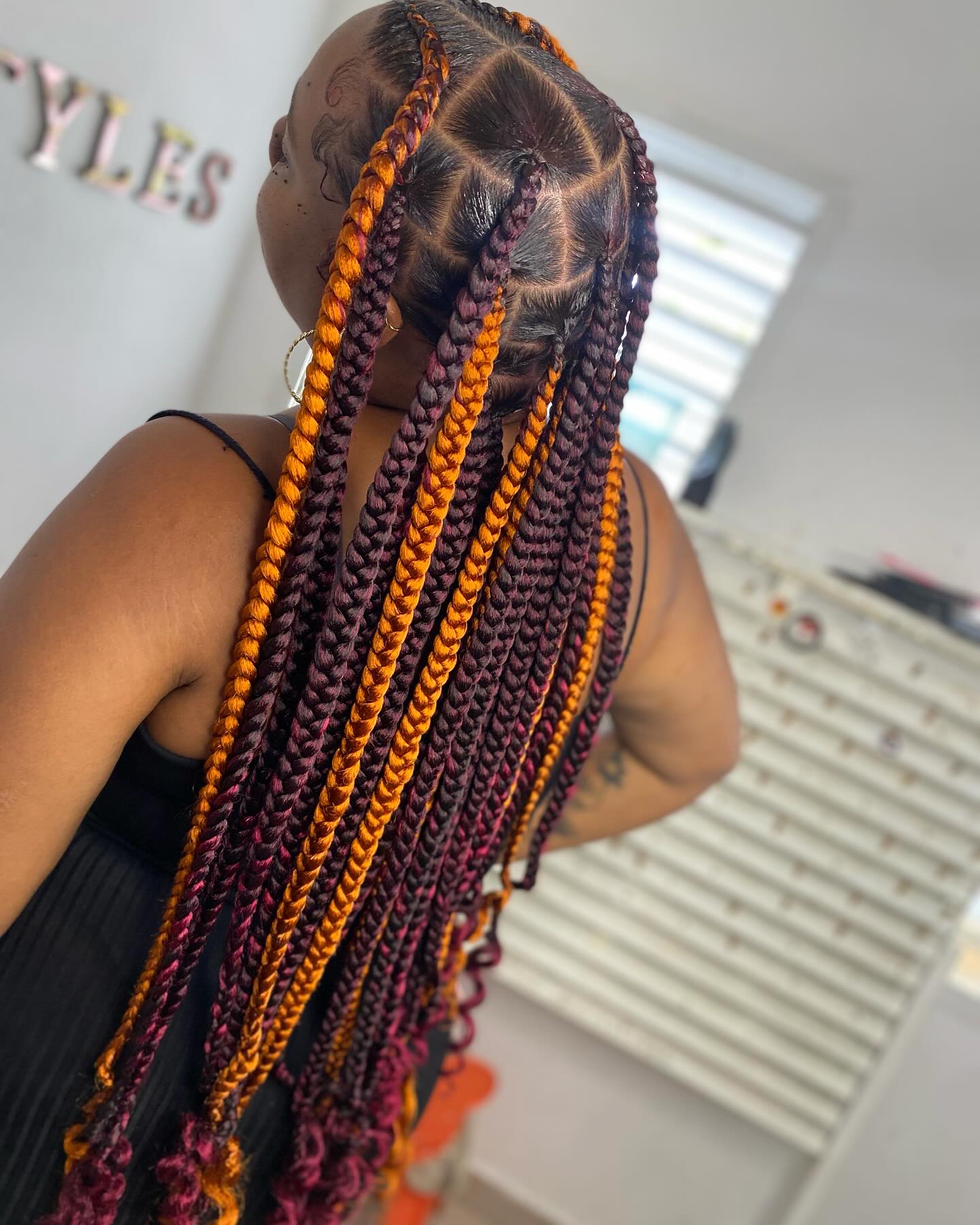 Vibrant Long Knotless Braids with Sunset Ombre Tones