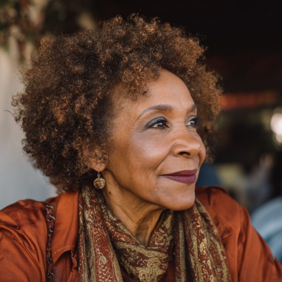 Textured Curly Cut with Light Brown Highlights
