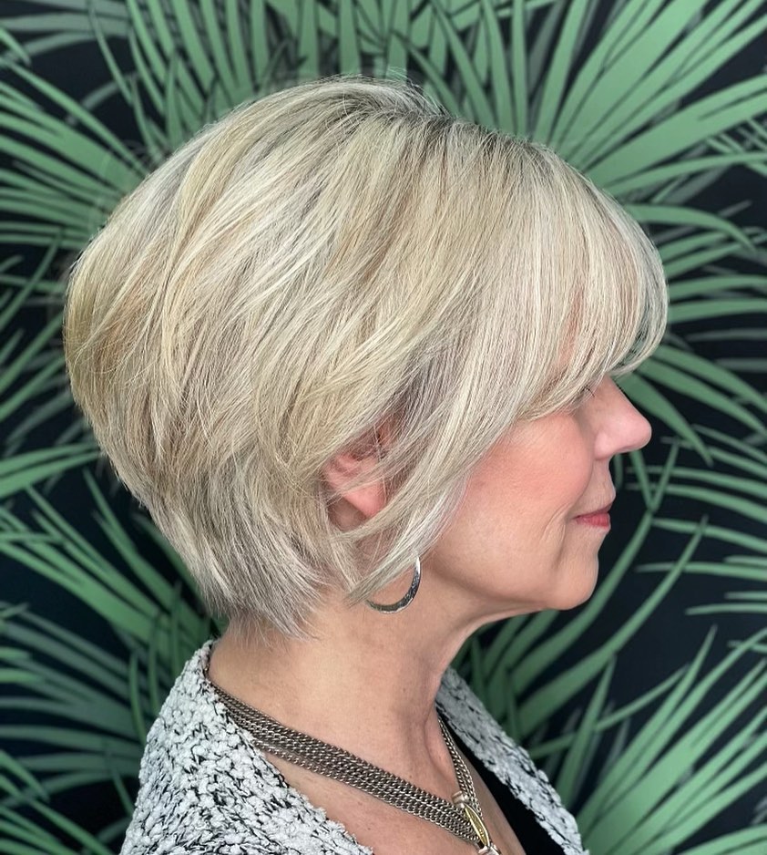 Softly Layered Blonde Bob with Side-Swept Bangs