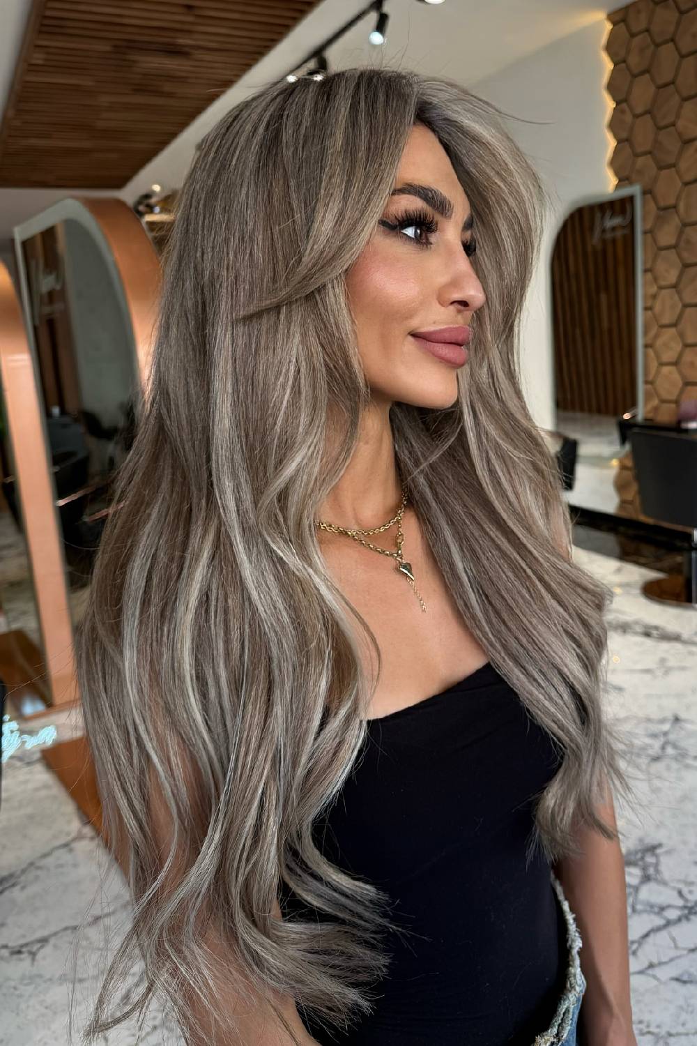 Glamorous Long Feathered Hair with Subtle Highlights