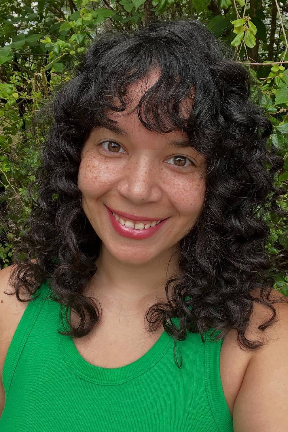 Playful Curly Cut with Wispy Bangs