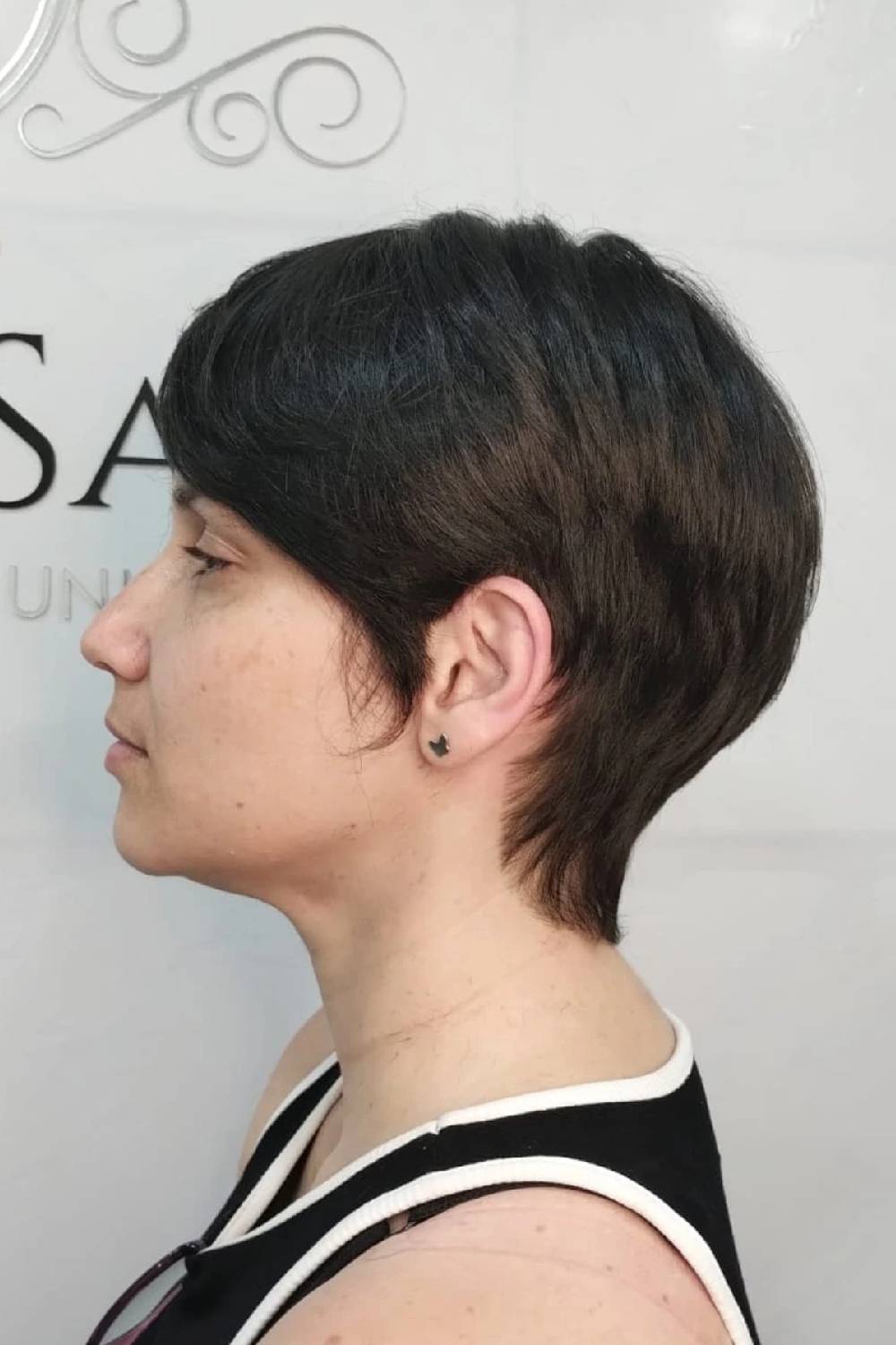 Sleek Short Pixie with Tapered Nape and Soft Side-Swept Bangs