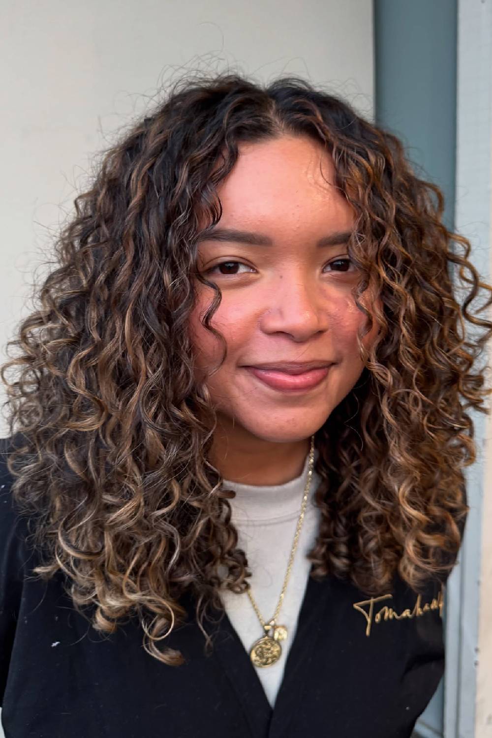 Soft Curly Lob with Subtle Highlights