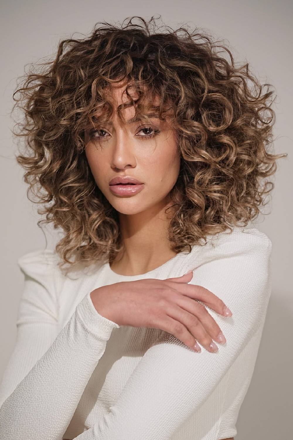 Textured Curly Cut with Soft Wispy Bangs