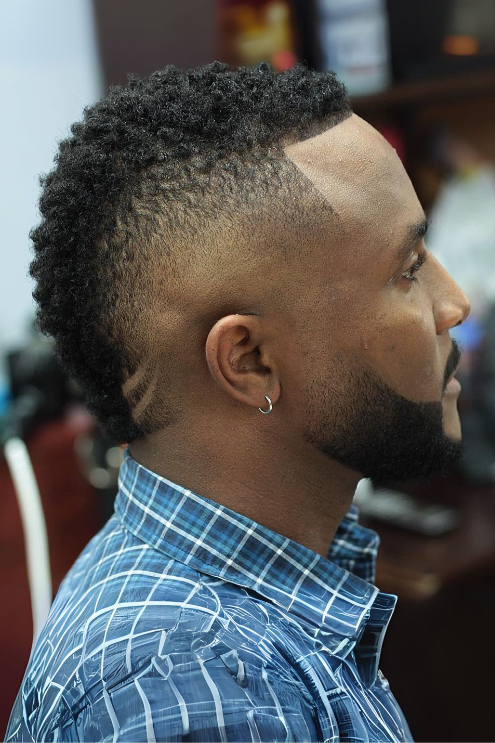 Textured High-Top Fade with Intricate Line Design