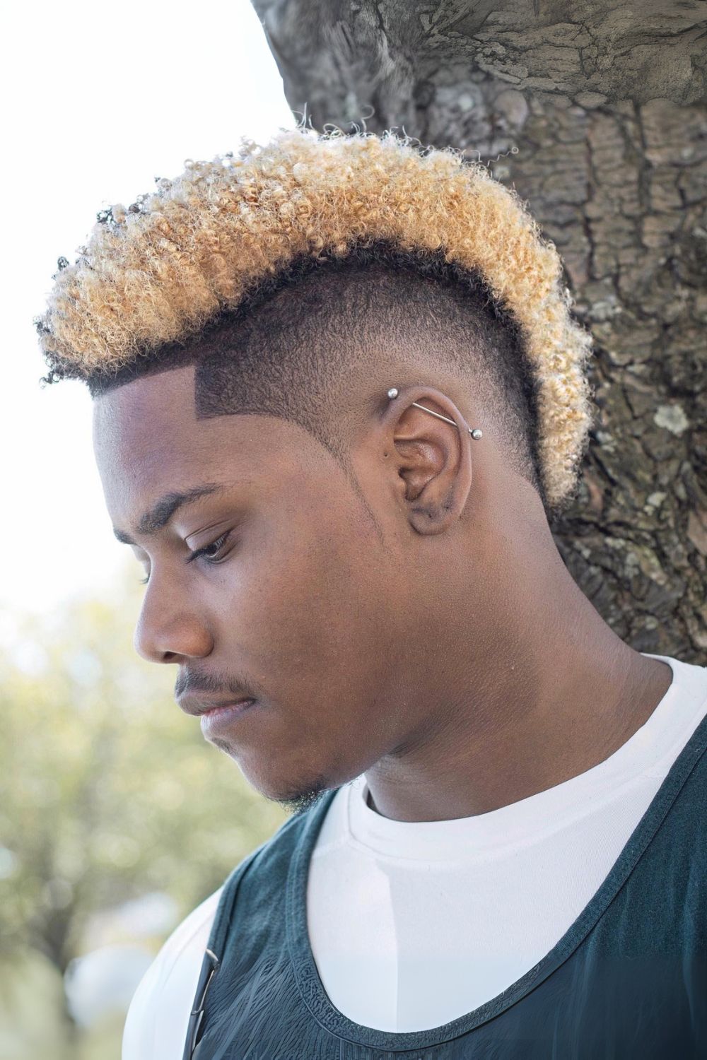 Textured High-Volume Curly Mohawk with Tapered Sides