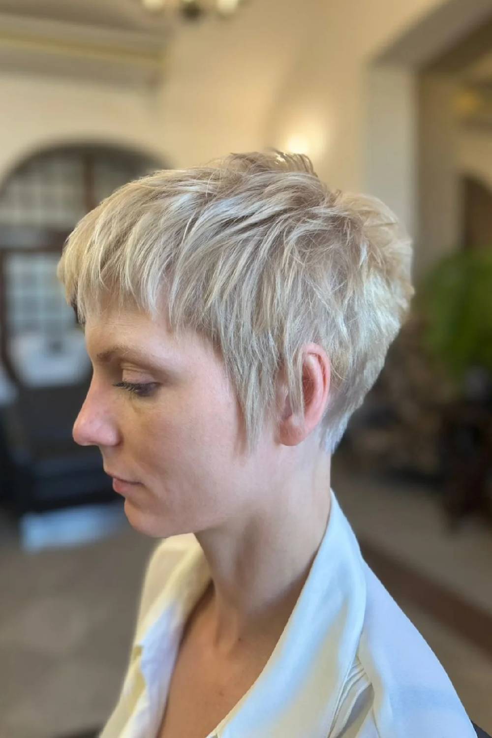 Textured Platinum Pixie Cut with Playful Fringe