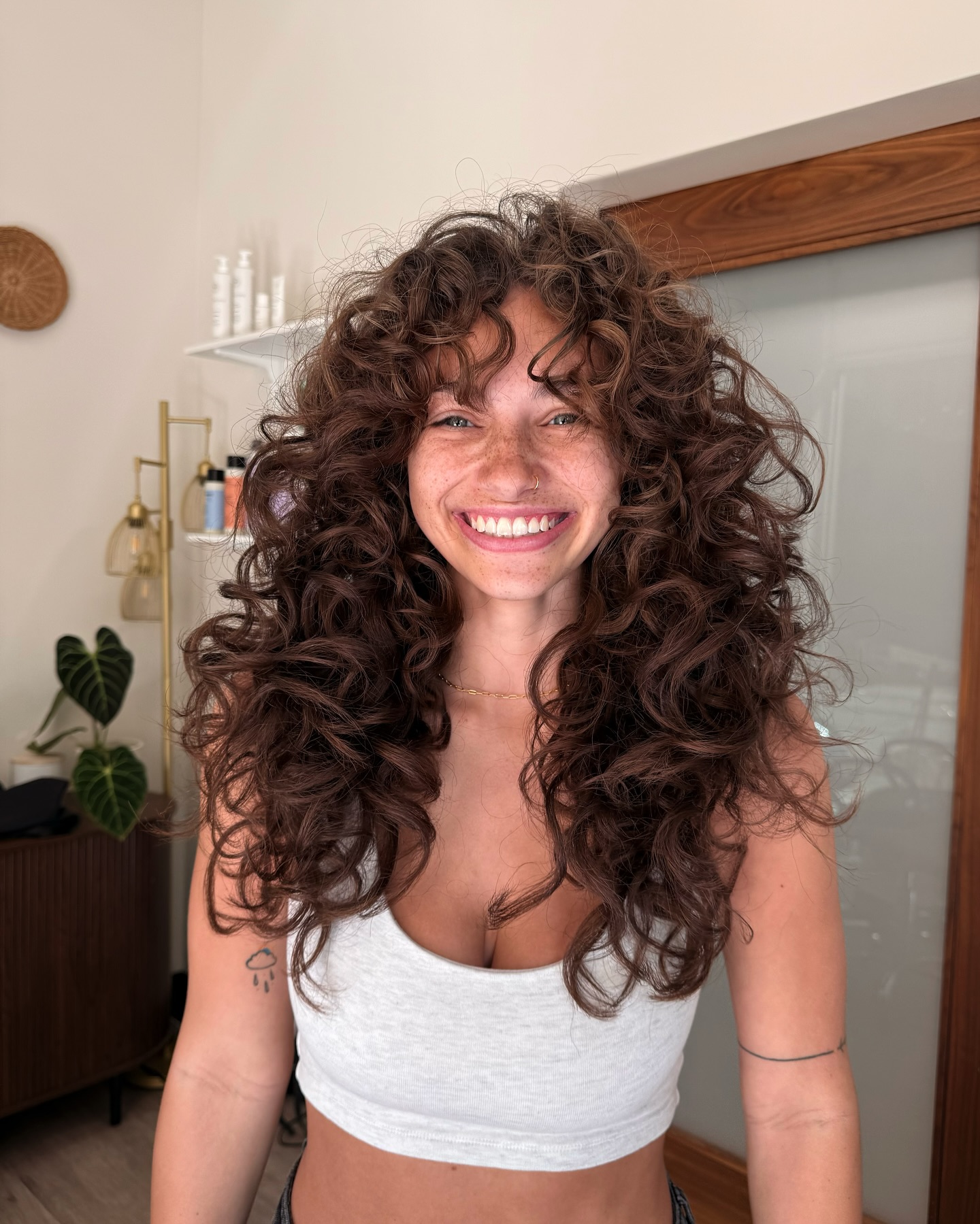 Bold Curly Layers with Soft Face-Framing Curls