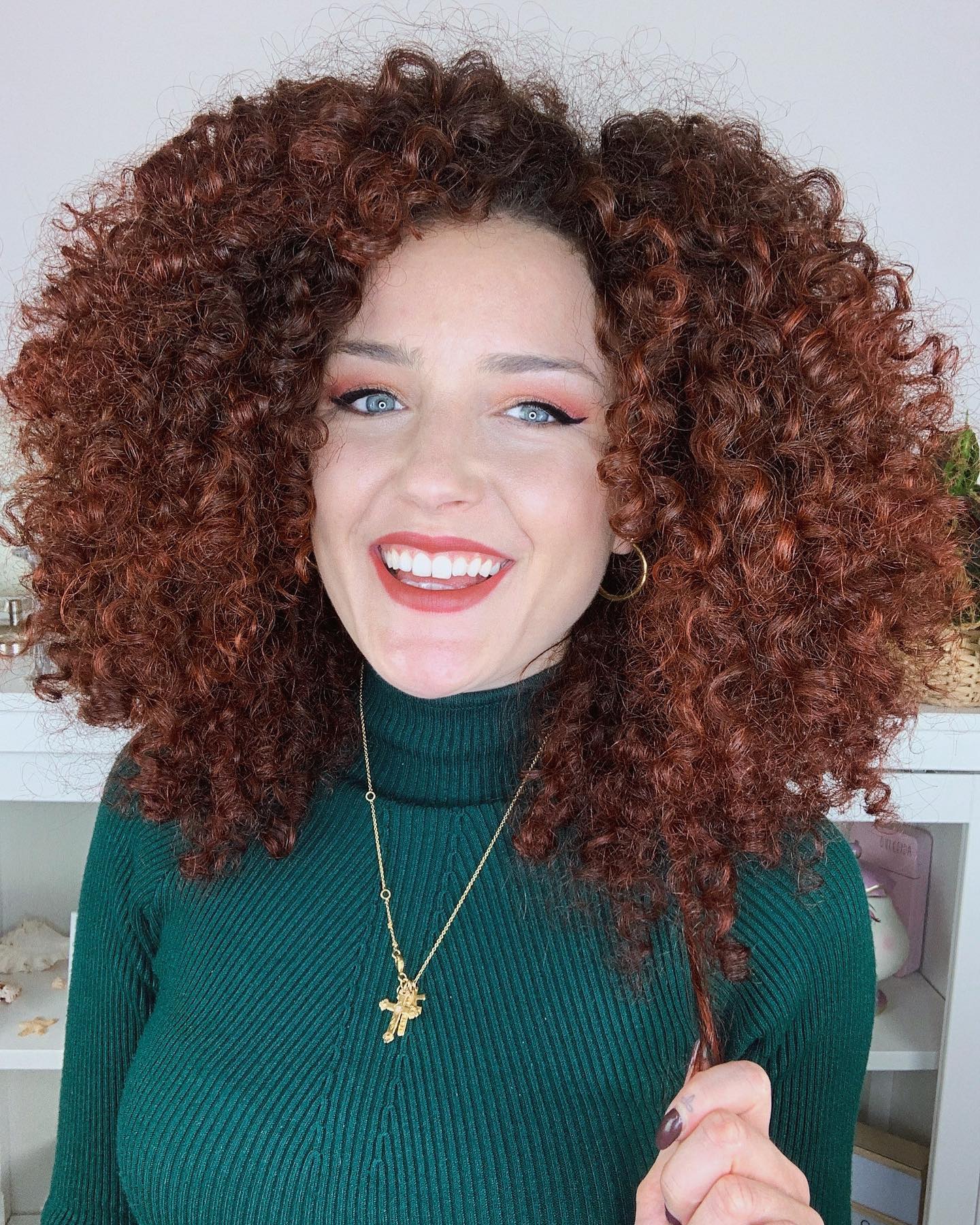 Bold Voluminous Curly Cut with Rich Copper Tones