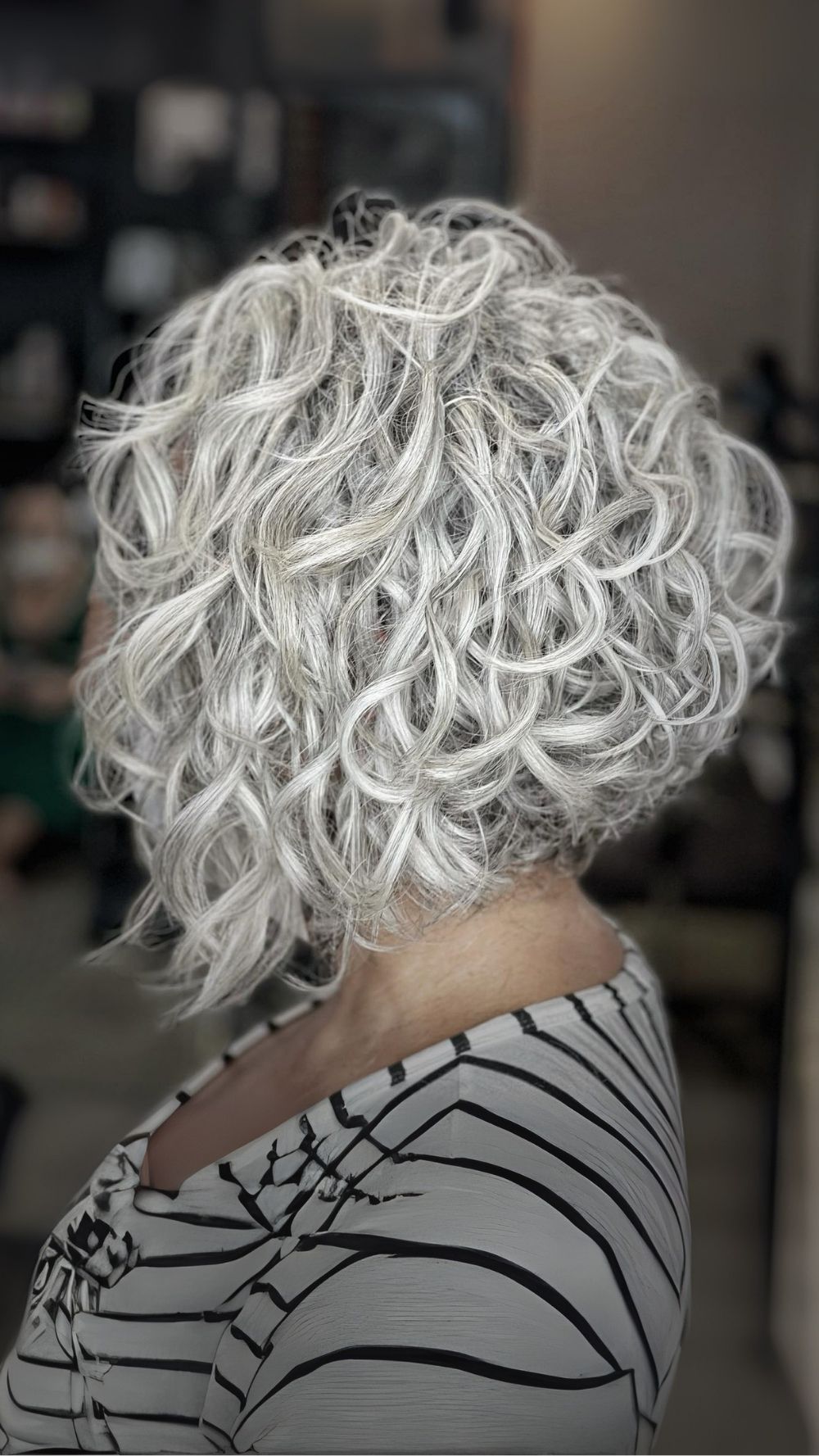 Textured Silver Stacked Curly Bob with Defined Curls