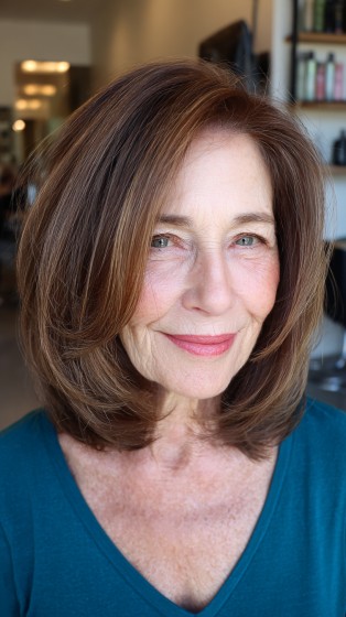 Elegant Layered Midi Bob with Subtle Movement