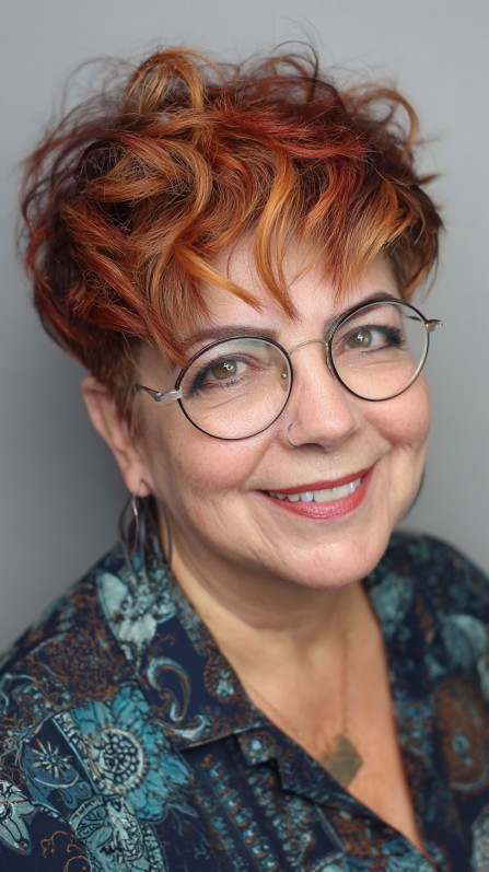 Vibrant Curly Pixie Bob with Luminous Highlights