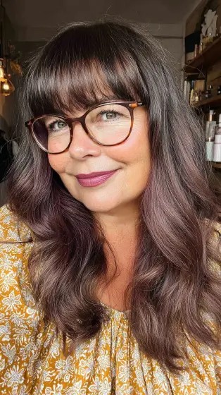 Chic Long Layered Waves with Bold Bangs