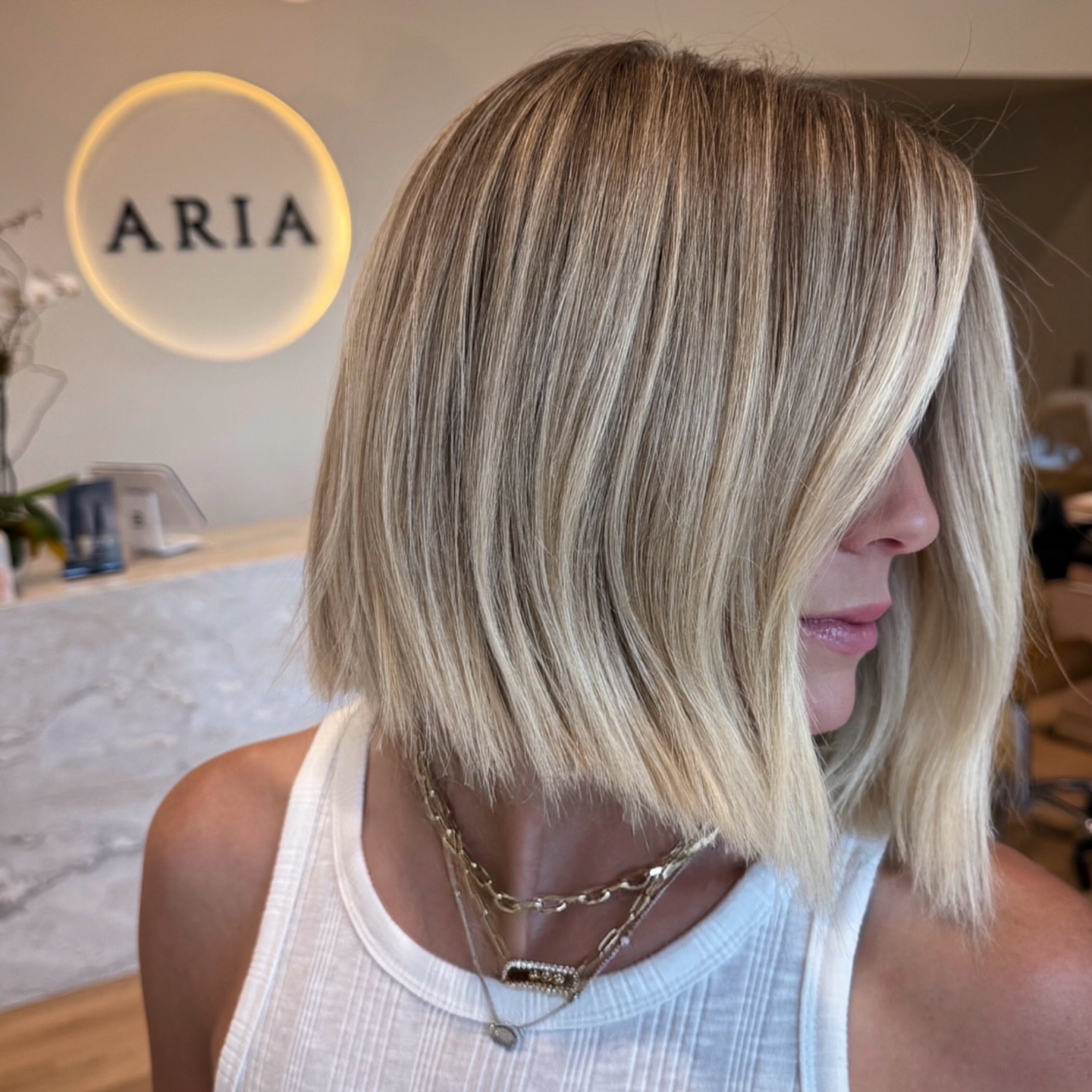 Modern Sophisticated Blunt Blonde Bob with Subtle Dimension