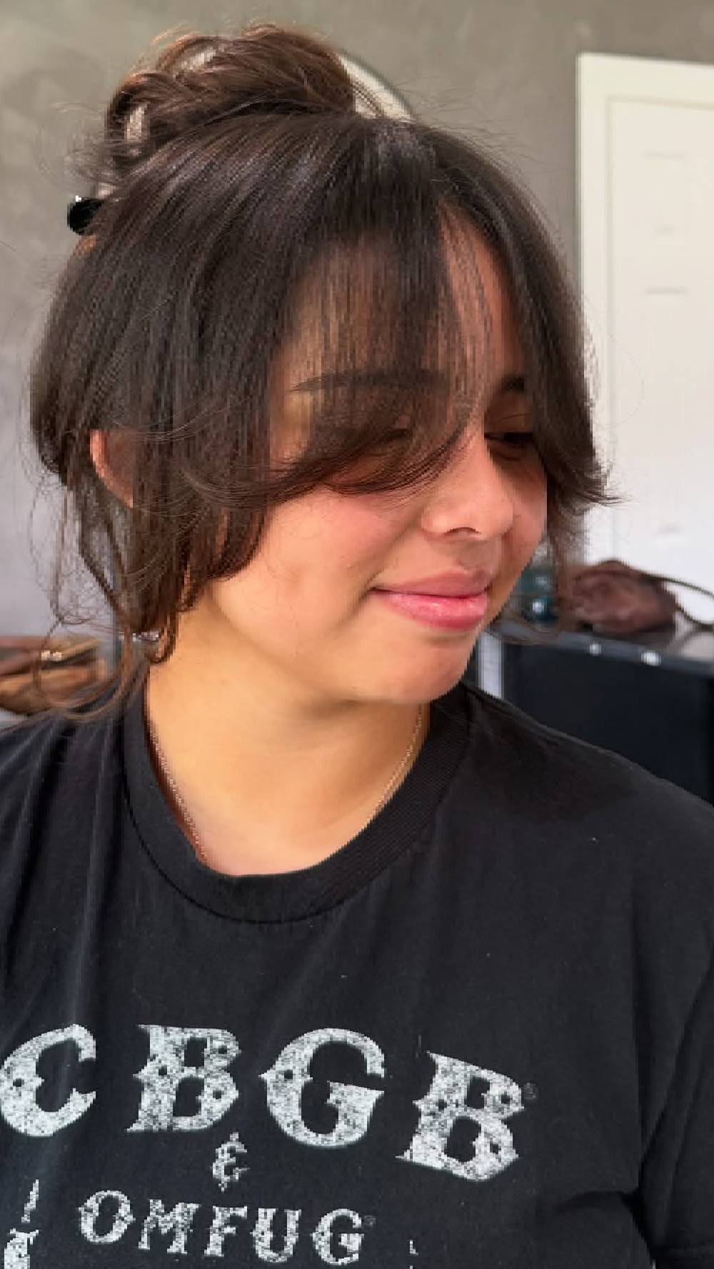 Softly Textured Bangs with Playful Updo