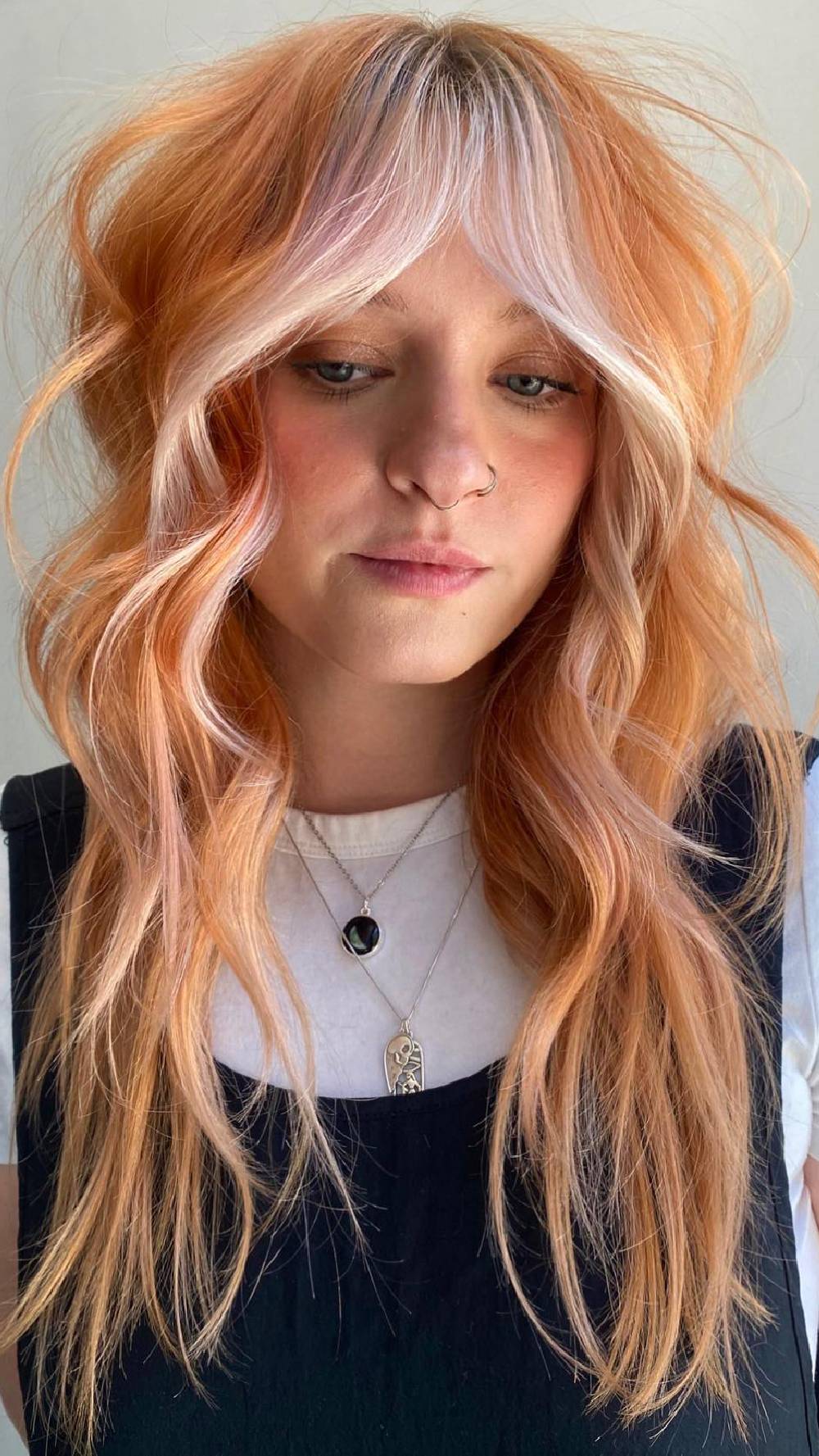 Vibrant Layered Waves with Bold Face-Framing Bangs