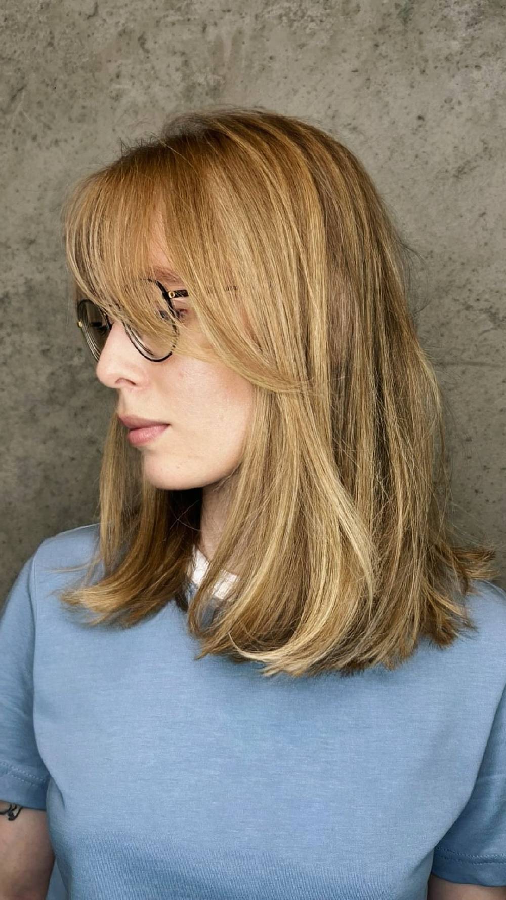 Softly Fringed Medium-Length Cut with Subtle Highlights