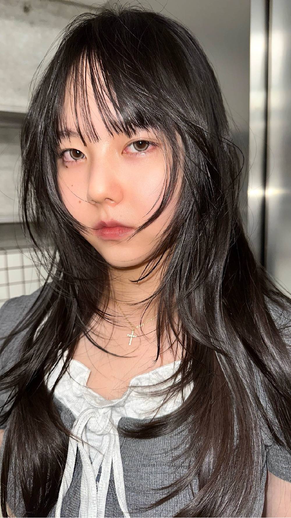 Trendy Long Hair with Wispy Bangs and Face-Framing Layers