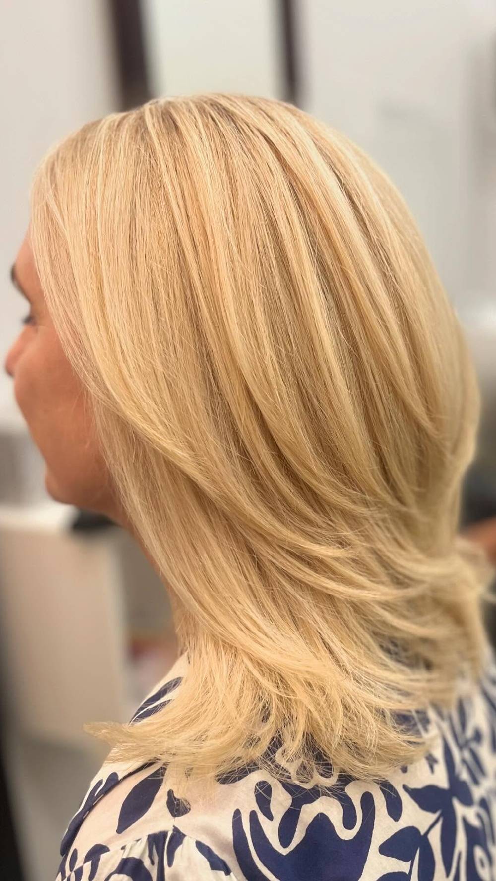 Layered Mid-Length Blonde Hairstyle with Soft Movement