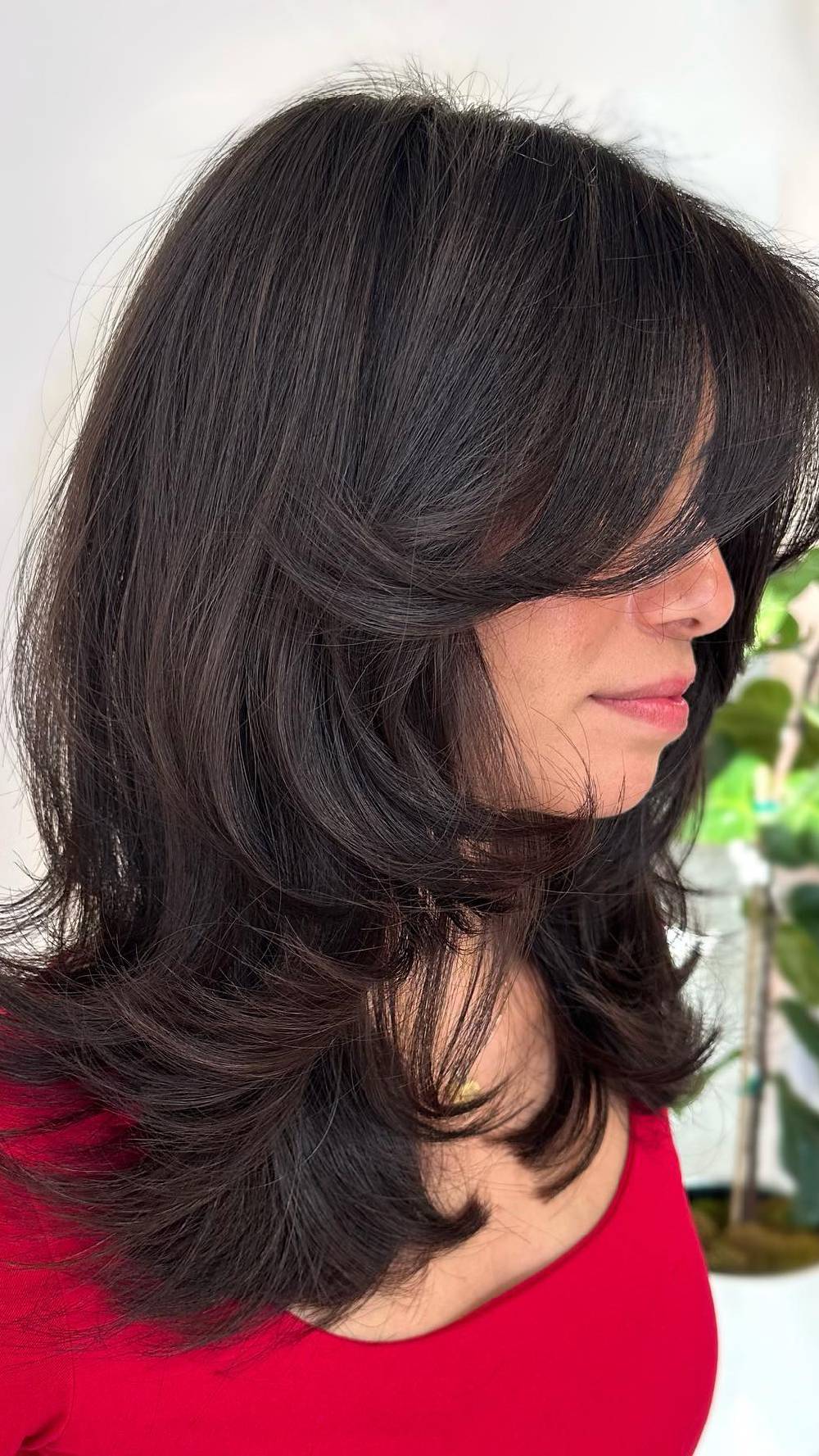 Stylish Mid-Length Cut with Soft Layers and Bangs