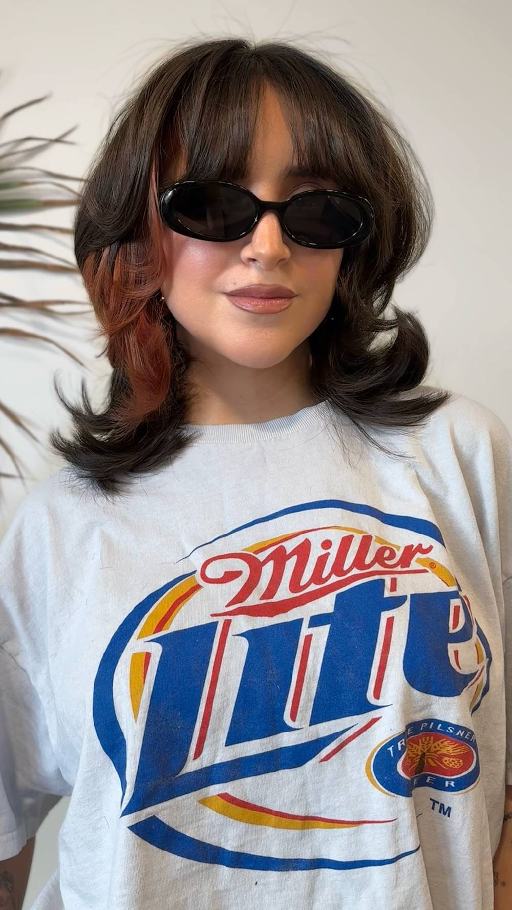 Stylish Mid-Length Cut with Vibrant Highlights