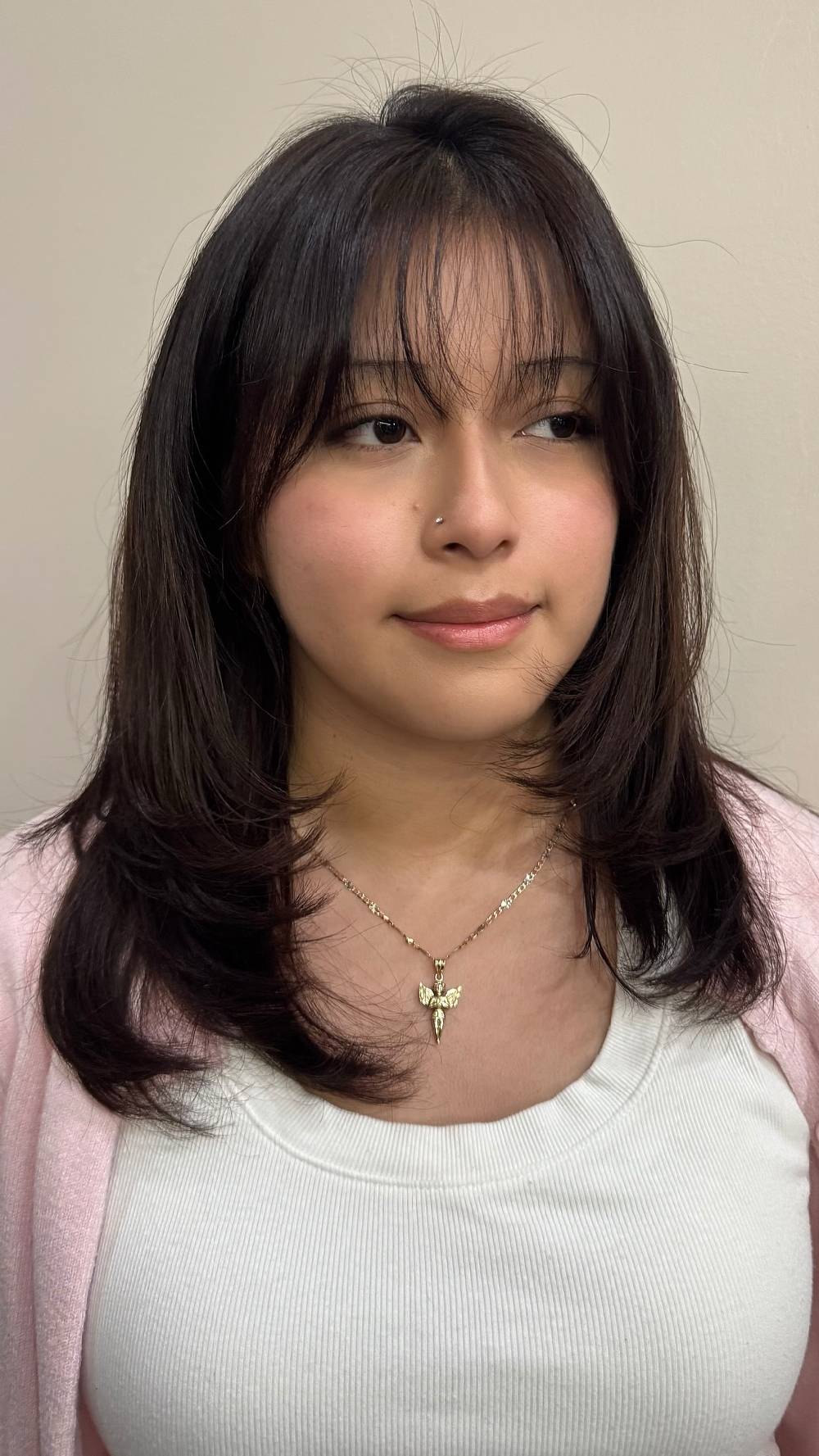 Modern Face-Framing Layers with Soft Bangs